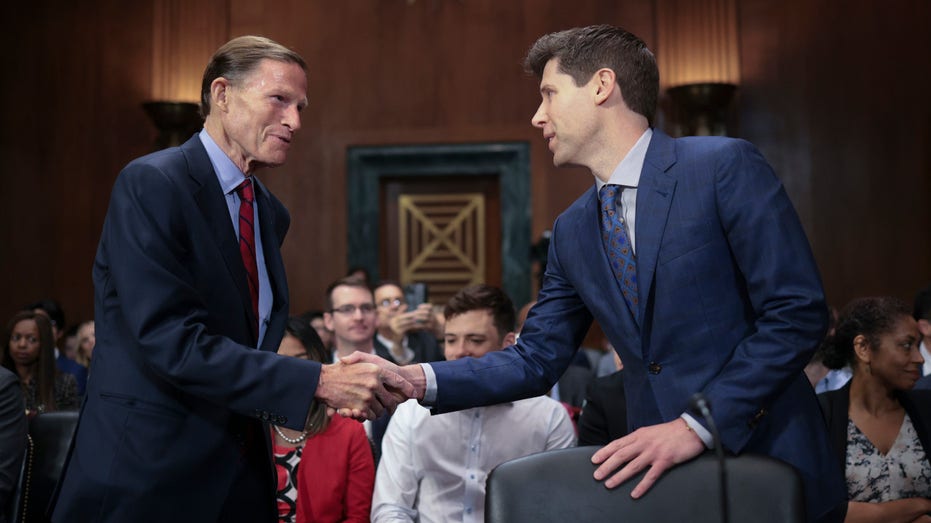 Samuel Altman, CEO of OpenAI, greets committee chairman Sen. Richard Blumenthal (D-CT)