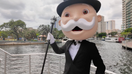 The &quot;Monopoly Man&quot; poses for a photograph along the New River in Fort Lauderdale, Florida, which has been selected as the newest city edition for the popular board game.