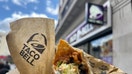 15 May 2024, Great Britain, London: The Taco Bell logo and a burrito can be seen outside a branch of the chain in London. The US fast food chain Taco Bell is expanding into the German market. The first restaurant will open in Berlin this summer, with more to follow. Photo: Julia Kilian/dpa (Photo by Julia Kilian/picture alliance via Getty Images)