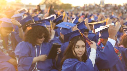 Sun Valley, CA - June 04: Students turn their tassels to the other side towards the end of the graduation at Polytechnic High School on Tuesday, June 4, 2024 in Sun Valley, CA.