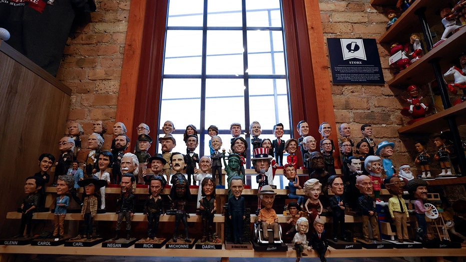 Bobbleheads featuring historical and fictional celebrities are on display at the National Bobblehead Hall of Fame