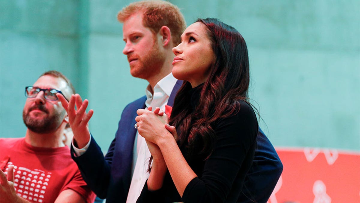 Britains Prince Harry and his fiancee Meghan Markle visit the Terrence Higgins Trust World AIDS Day charity fair at Nottingham Contemporary in Nottingham, Britain, December 1, 2017. REUTERS/Adrian Dennis/Pool - RC1473D09210