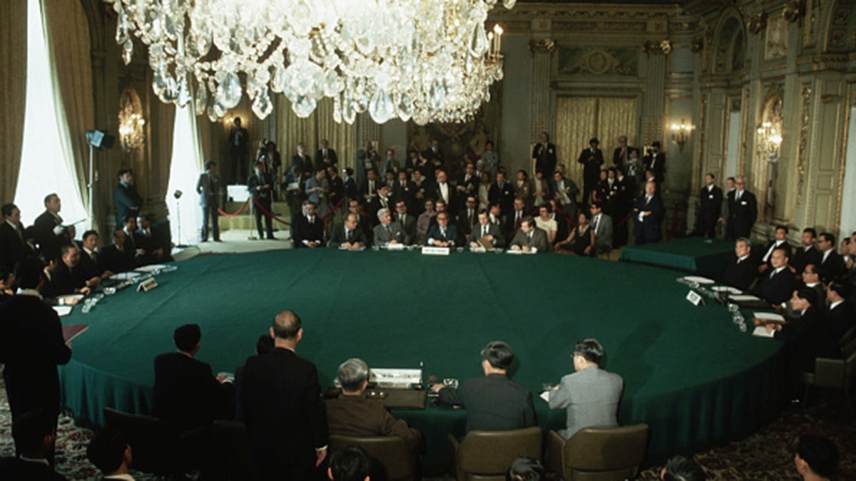 Representatives from the four factions of the Vietnam War meet in Paris to sign a peace agreement. 