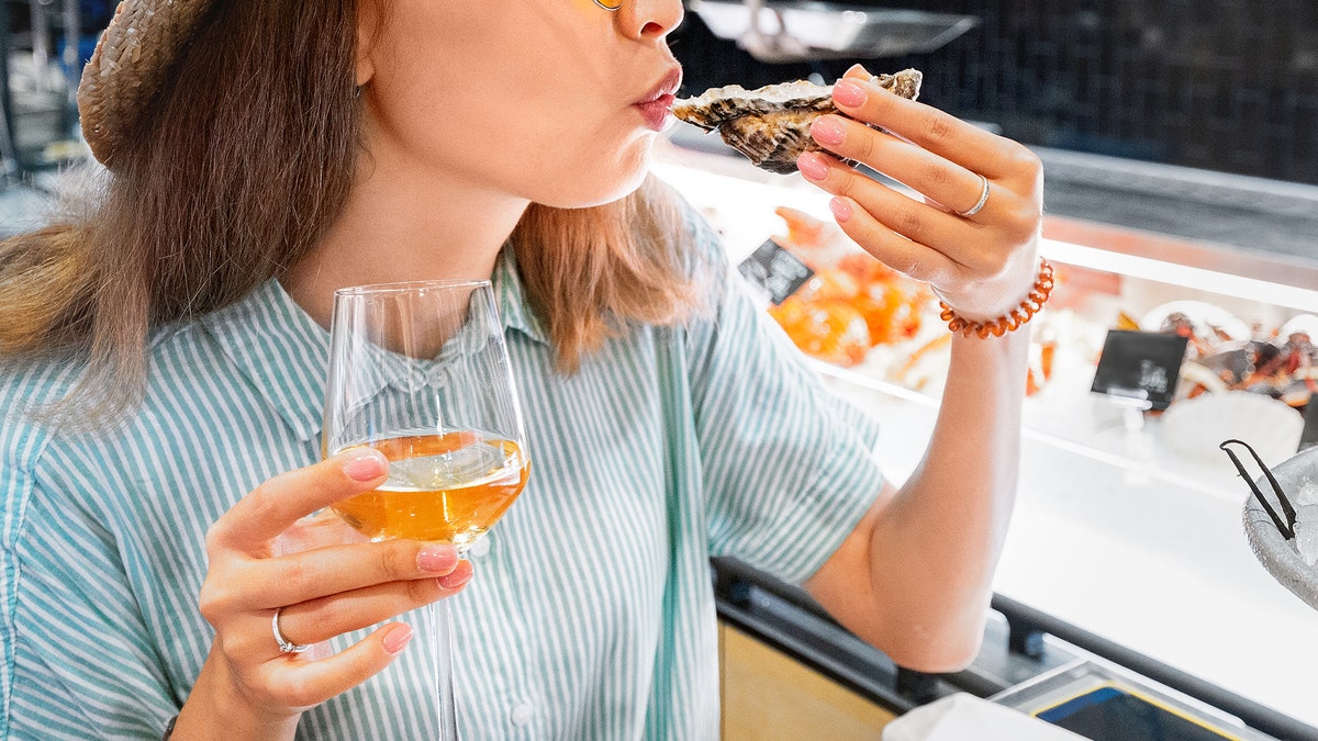 woman eating at outdoor restaurant