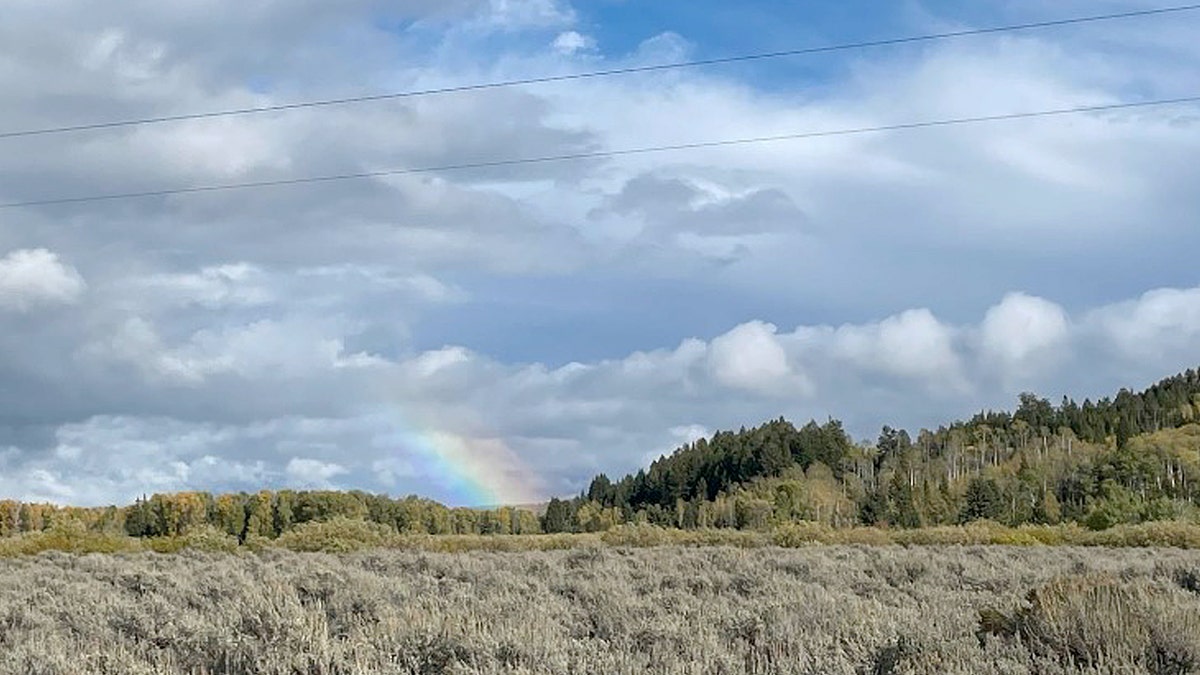 Reporters witnessed a rainbow overhead just moments after authorities removed Gabby Petito's remains from a campsite in Wyoming's Bridger-Teton National Forest.