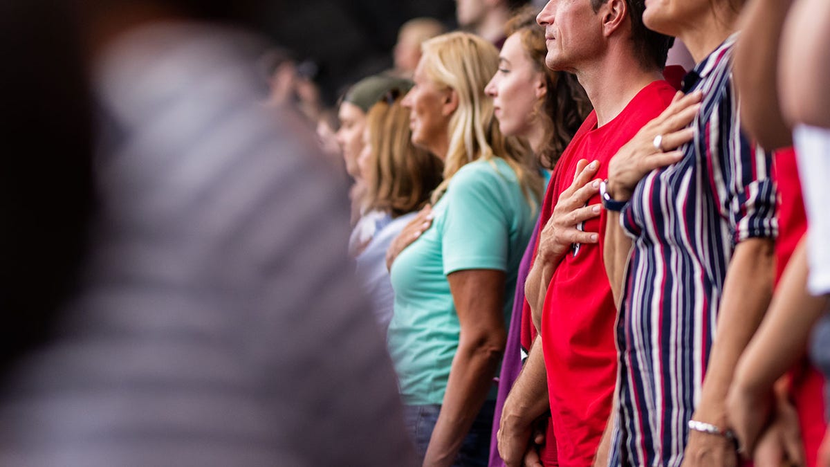 TikTok was horrified by the sight of people standing for the national anthem at a restaurant.