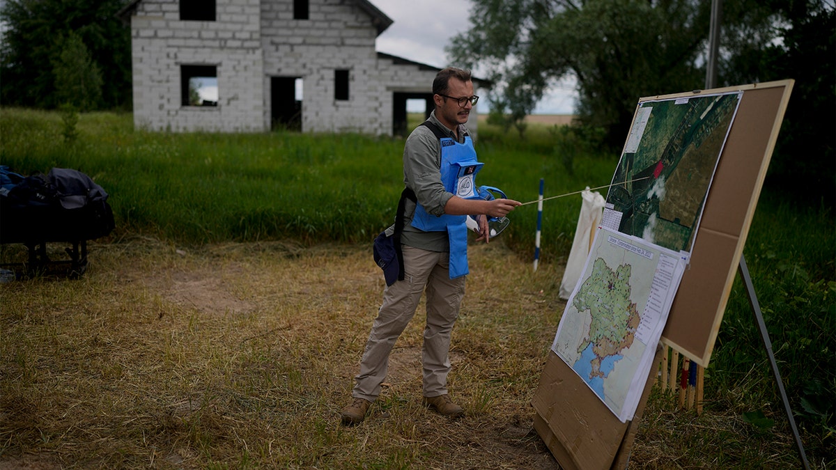 Worker explains how his team looks for mines in Ukraine