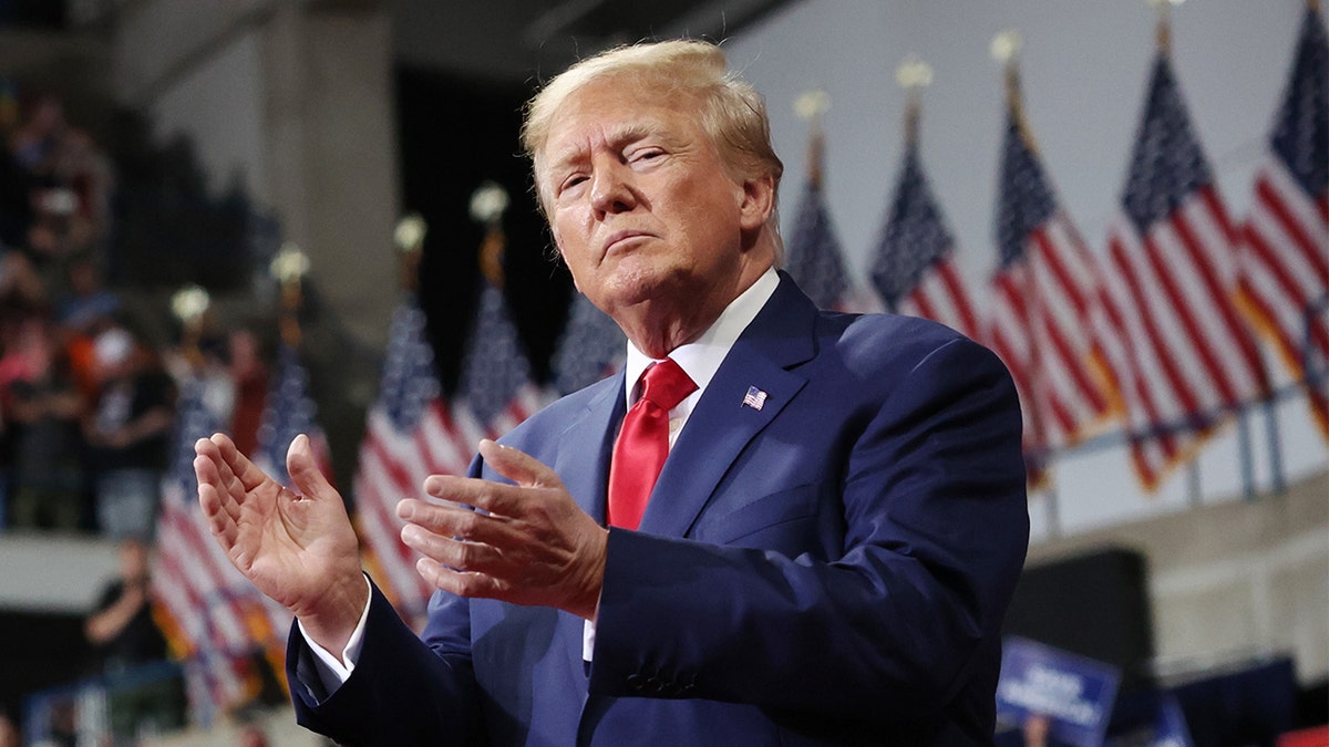 Former President Trump clapping at September 2022 rally