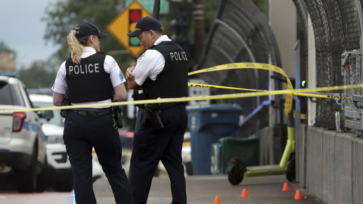 Chicago police stand near a crime scene