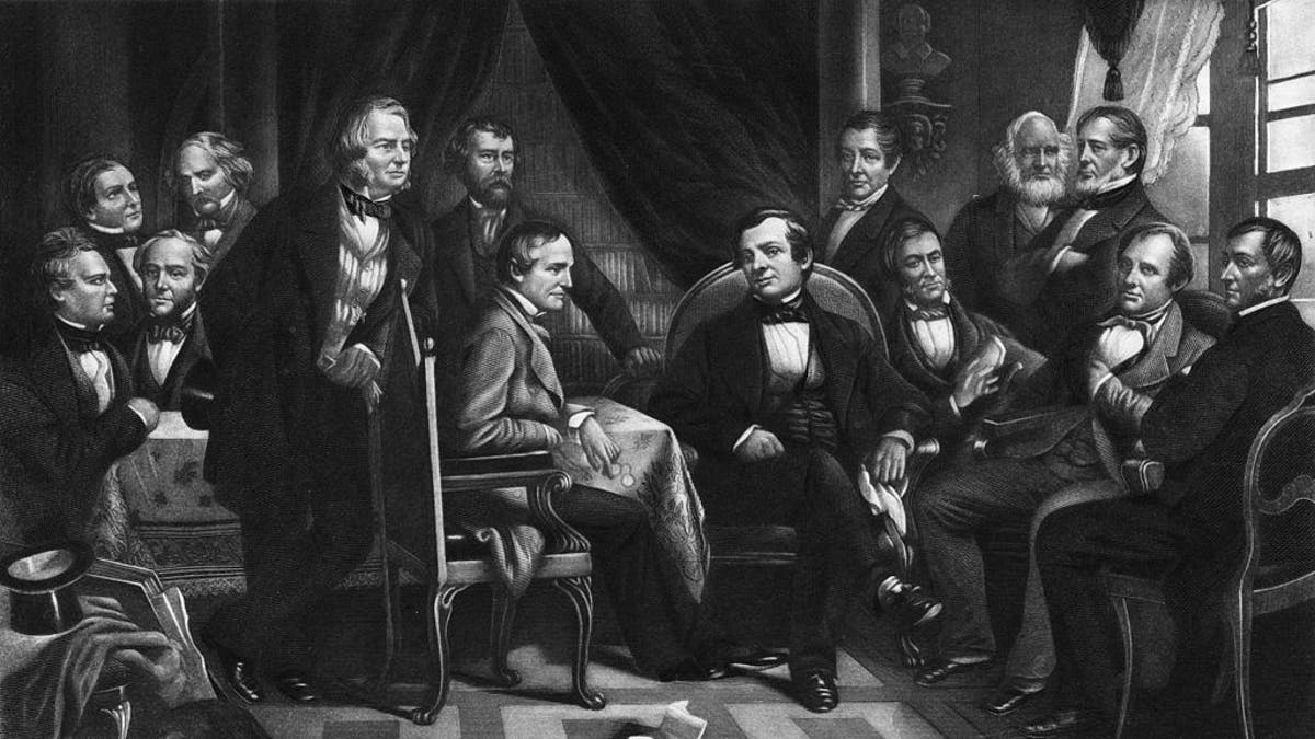 American author, biographer, historian and diplomat Washington Irving (center, sitting in black suit) with literary friends, circa 1830. From left, Oliver Wendell Holmes Sr., William Gilmore Simms, Fitz-Greene Halleck, Nathaniel Hawthorne, Henry Wadsworth Longfellow, Nathaniel Parker Willis, William Hickling Prescott, (Irving), James Kirke Paulding, Ralph Waldo Emerson, William Cullen Bryant, John Pendleton Kennedy, James Fenimore Cooper and George Bancroft. From an original engraving by Geo. E. Perine. 