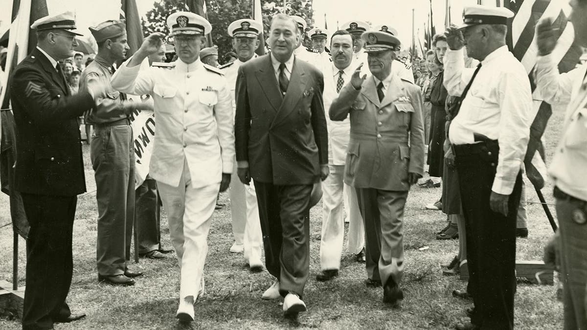 World War 2 hero inventor walks through a guard of honor