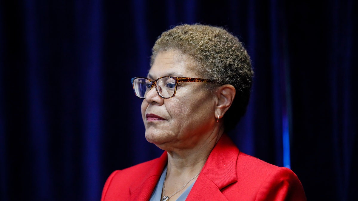 Karen Bass wearing a red jacket