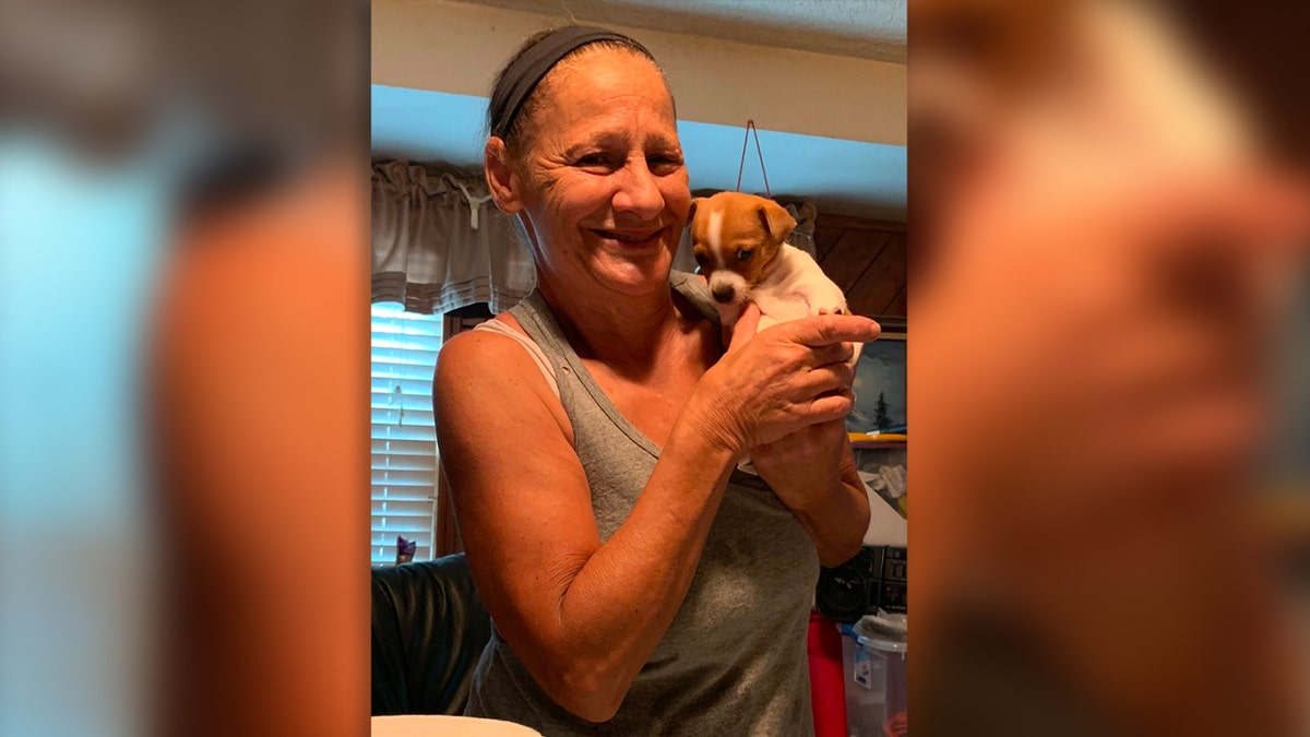 Missing New Jersey grandma Norma Yates poses with a puppy