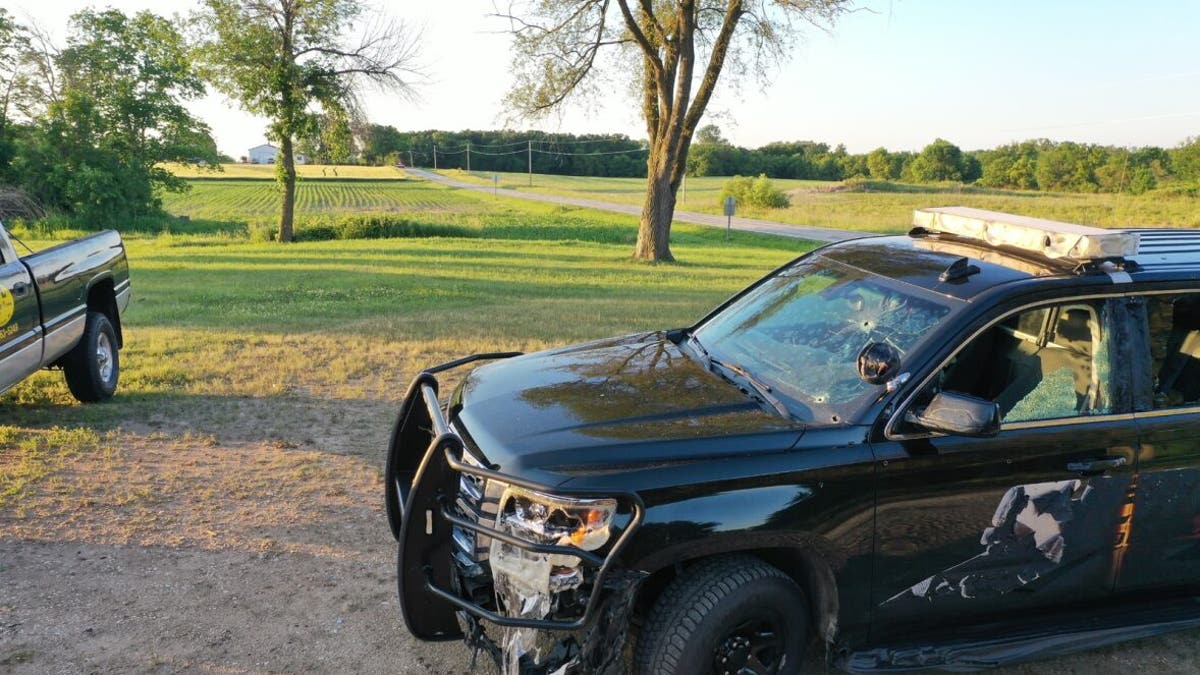 Responding officer from Jefferson County Sheriff's Office squad car filled with bullet holes