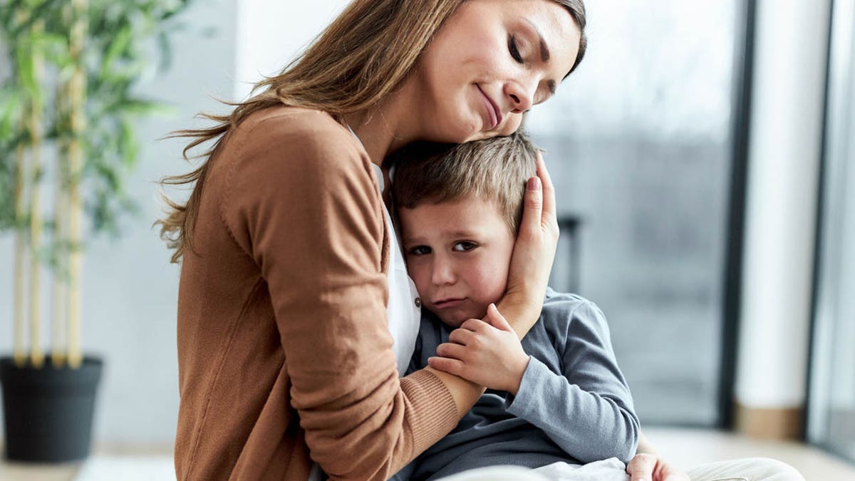 Mom and son hugging