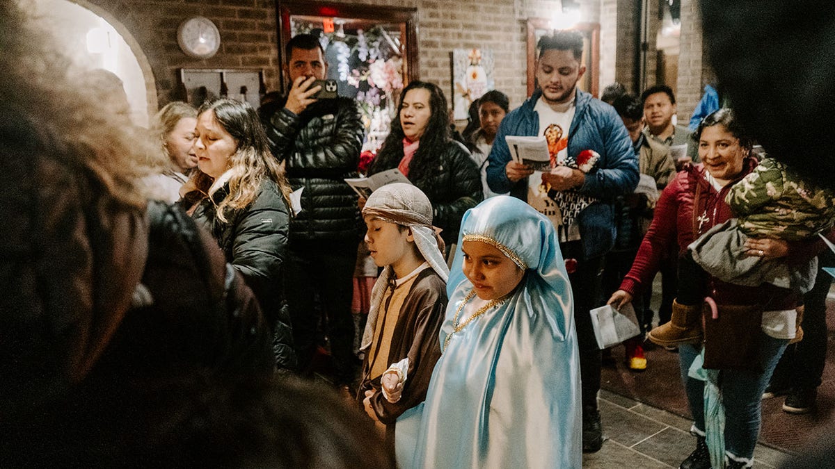 two children in costume in crowd