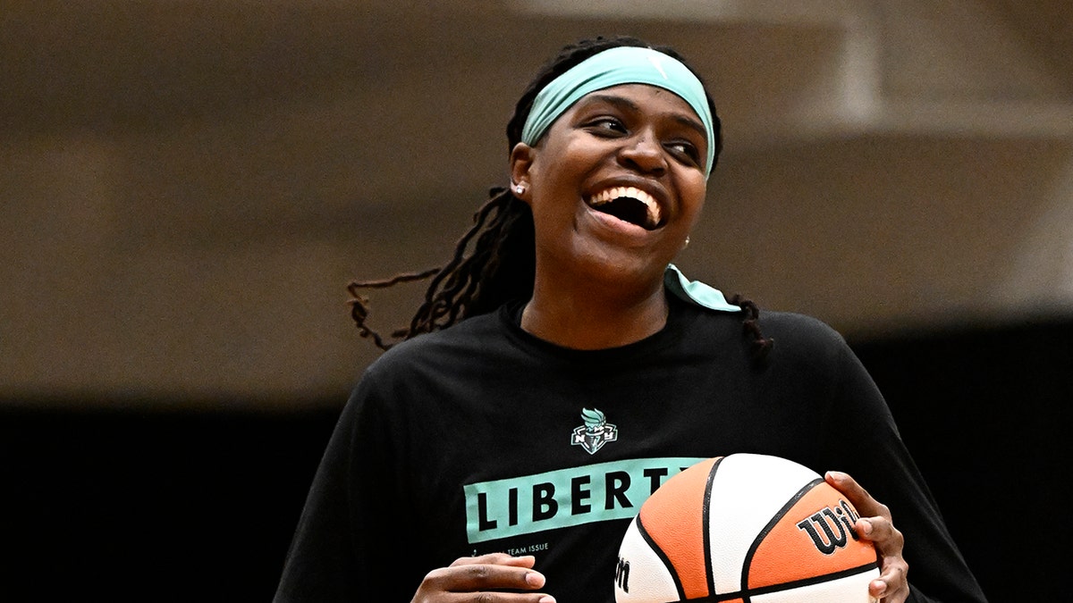 Jonquel Jones smiles on court