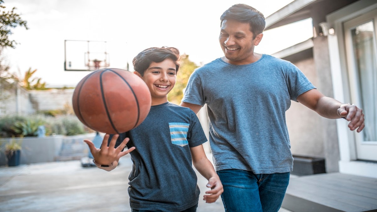 dad and son with basketball