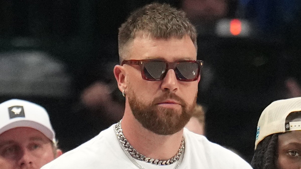 Travis Kelce looks on court