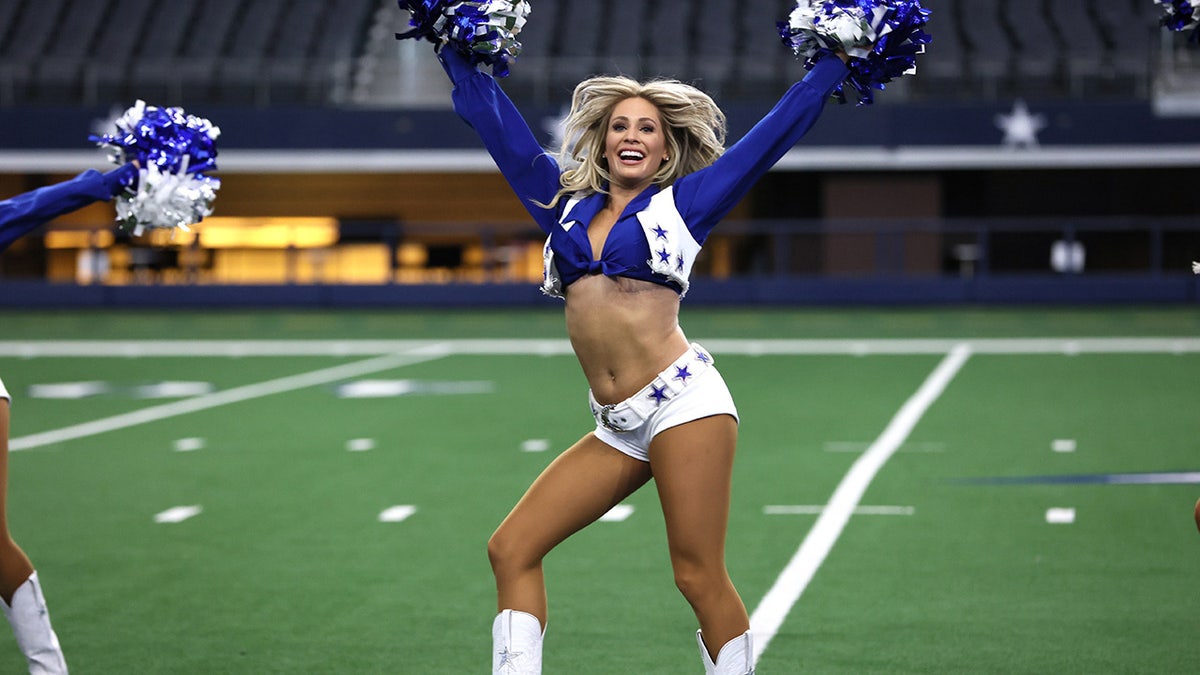 McKenzie on the field doing a cheer