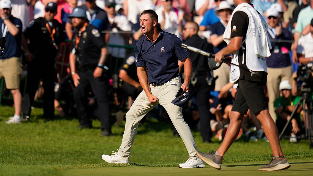 Bryson DeChambeau celebrates