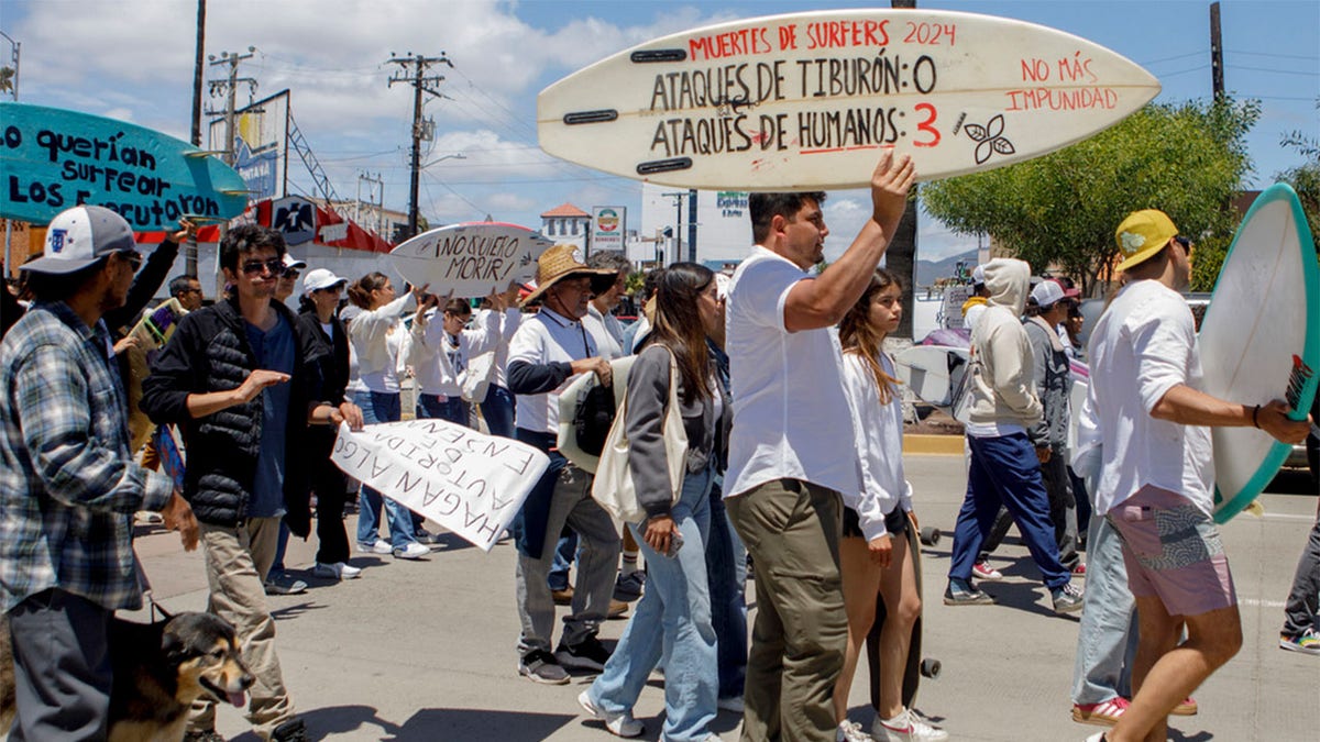 People protesting the surfers' murders