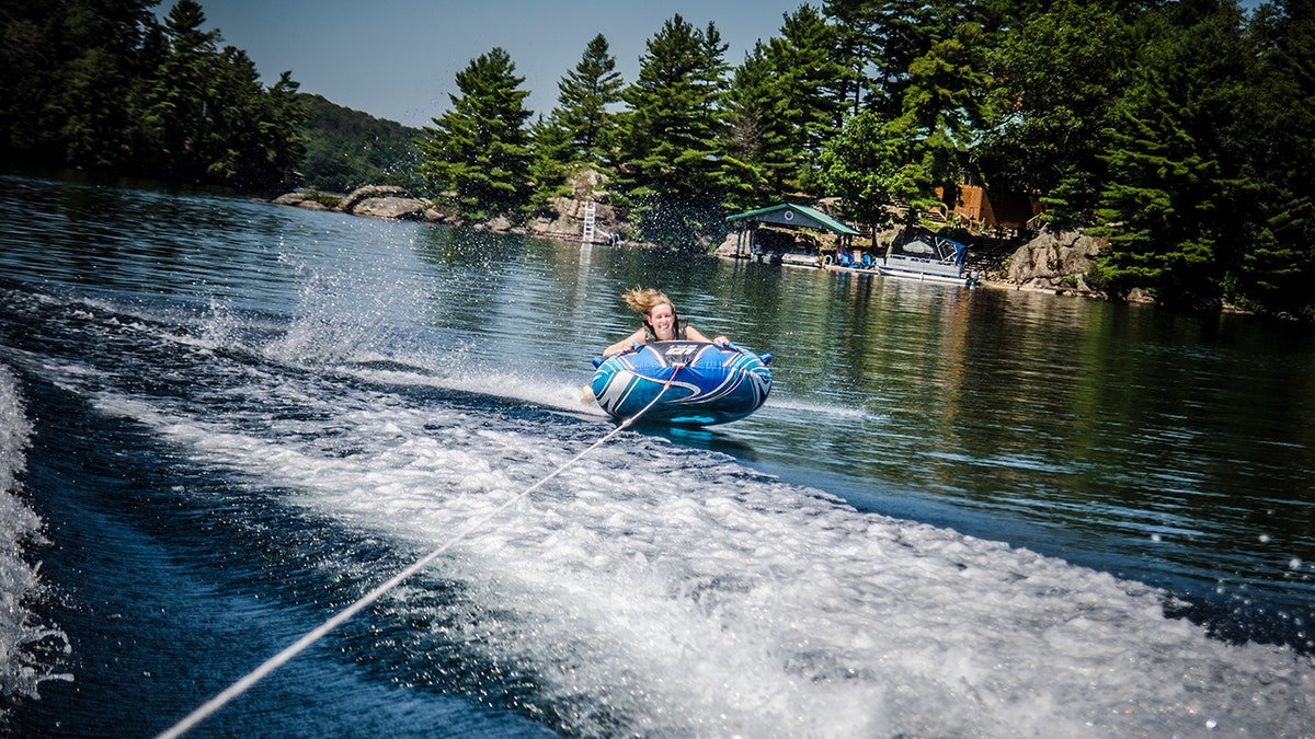 Woman tubing on lake