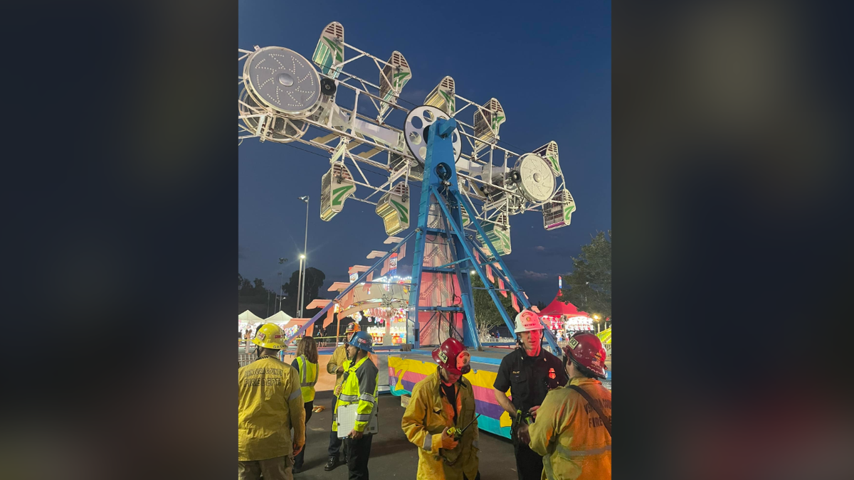 Frozen zipper ride with firefighters on scene