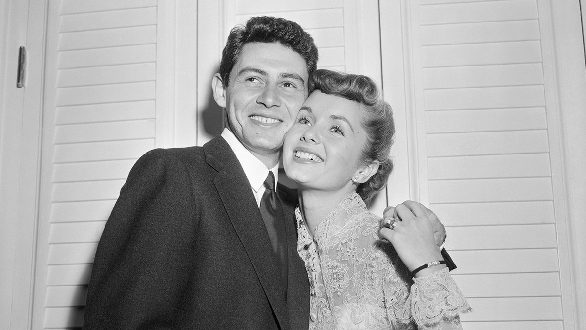 Eddie Fisher canoodling with his wife Debbie Reynolds.