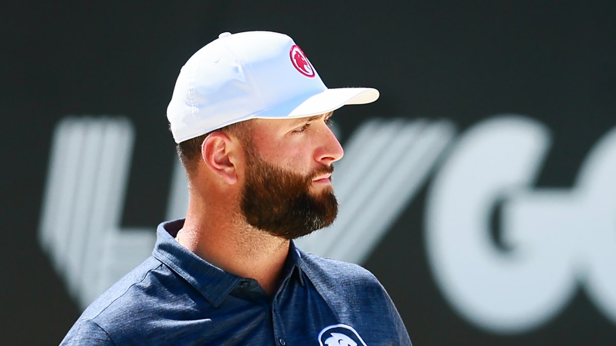 Jon Rahm looks on course