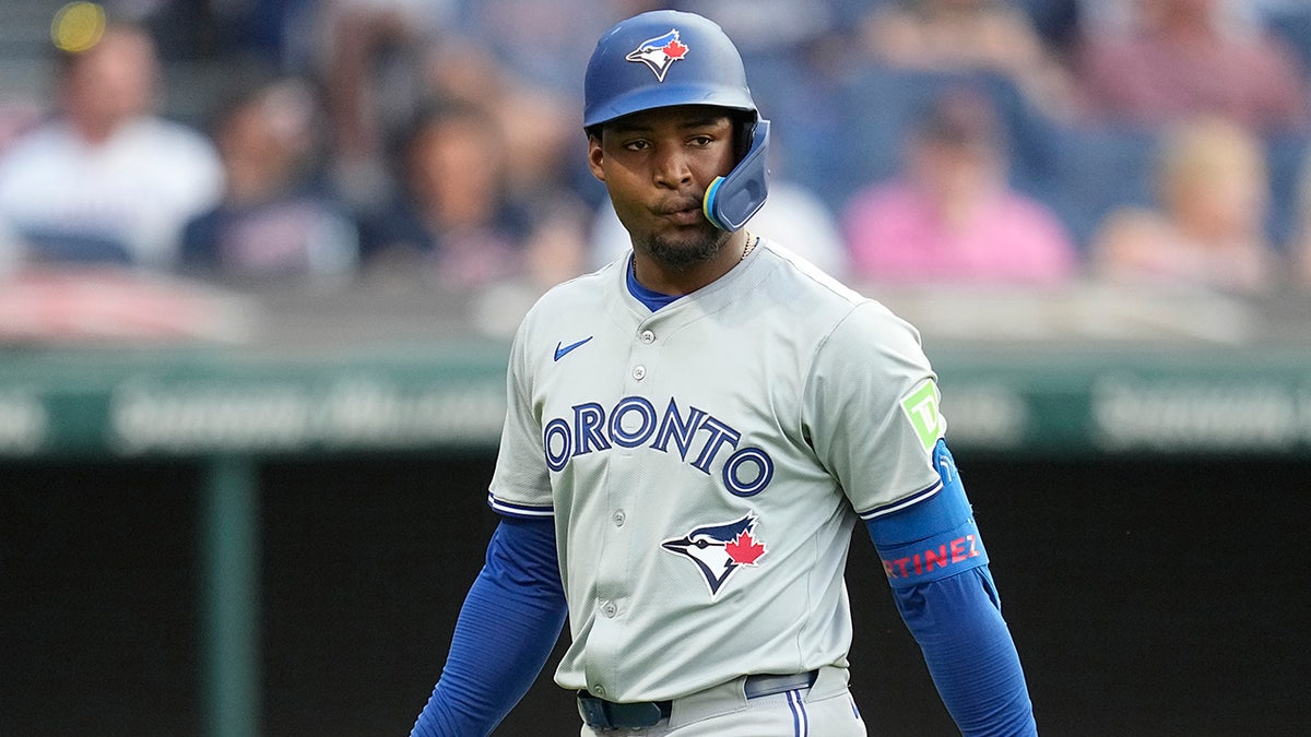 Orelvis Martinez walks to the dugout