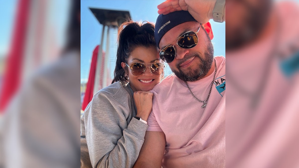 Reality star Jon Gosselin and girlfriend Stephanie smile for a photo.