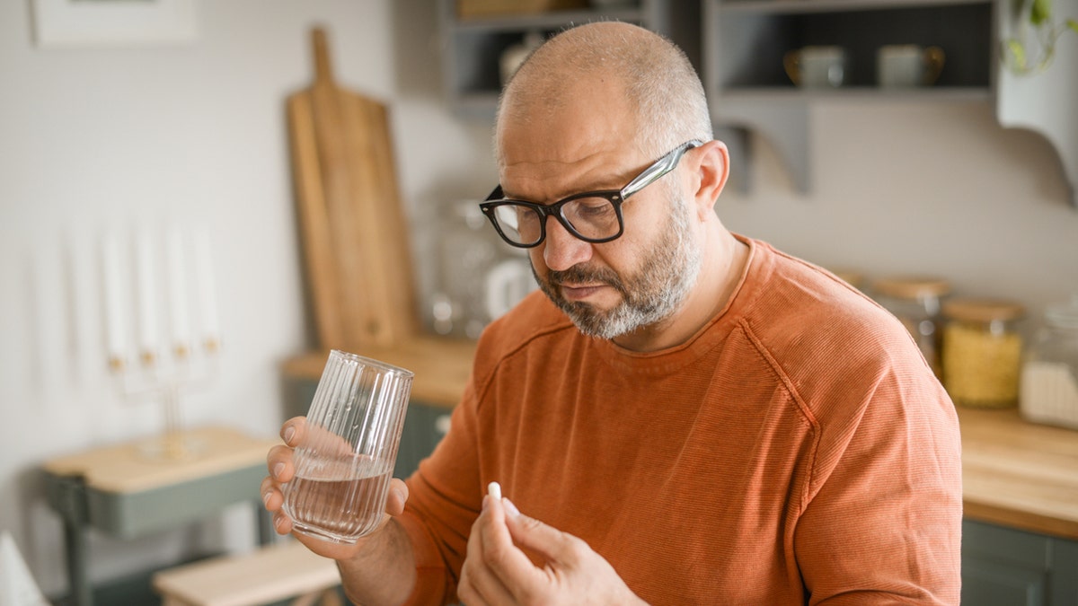 Man taking pill