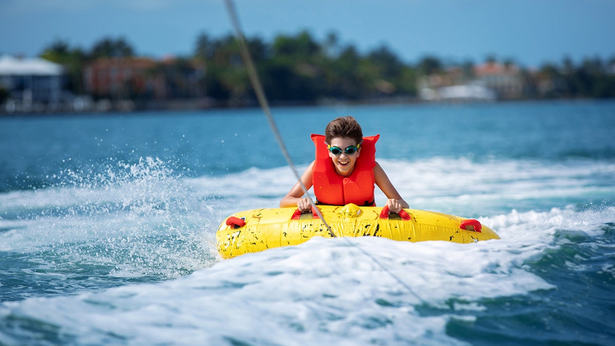 A boy tubing 