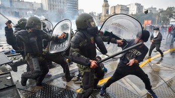 Riot police unleash tear gas, water cannons on rowdy anti-Milei protesters in Buenos Aires