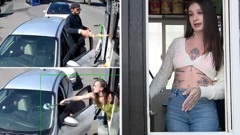 Bikini-clad barista takes hammer to customer's windshield after he throws coffee at her