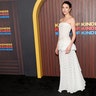 Margaret Qualley posed for photos in a strapless white Chanel gown at the premiere of "Kinds of Kindness."