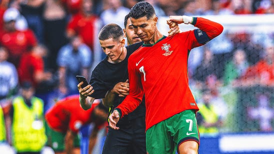 Martinez: Ronaldo 'lucky' not to be harmed by pitch invaders