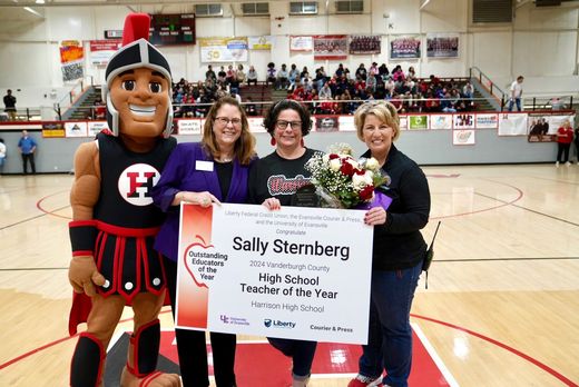 Sally Sternberg holding sign