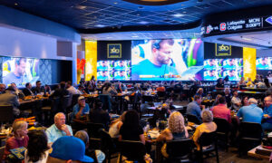 Fans watching video wall at 360 Sports Bar