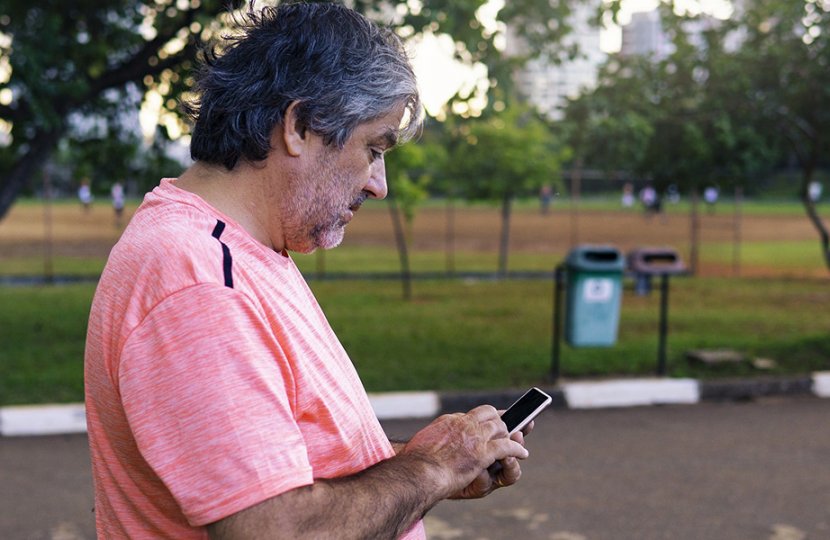 Image of elderly man using a cellphone