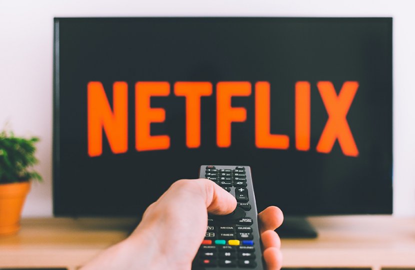 Photo of Netflix on a television and a remote control