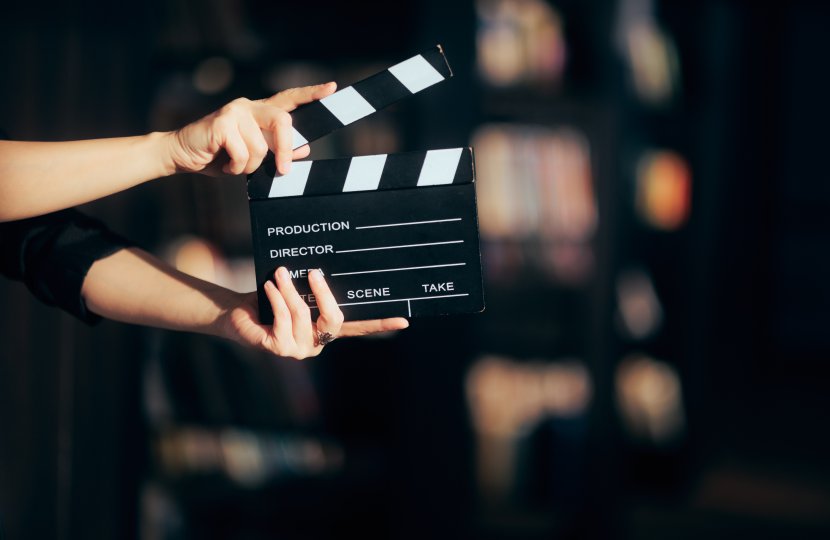 hands holding film slate