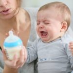 Baby crying, while mom tries to soothe