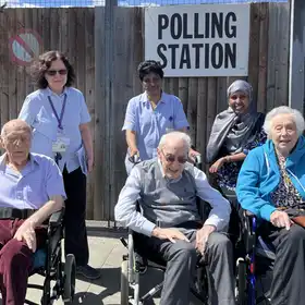 (l-r) Jack, 90, Hyman, 95, and Zara,100, are among the residents at Jewish Care's Otto Schiff care home who went to vote today, accompanied by social care coordinators (Photo: Jewish Care)