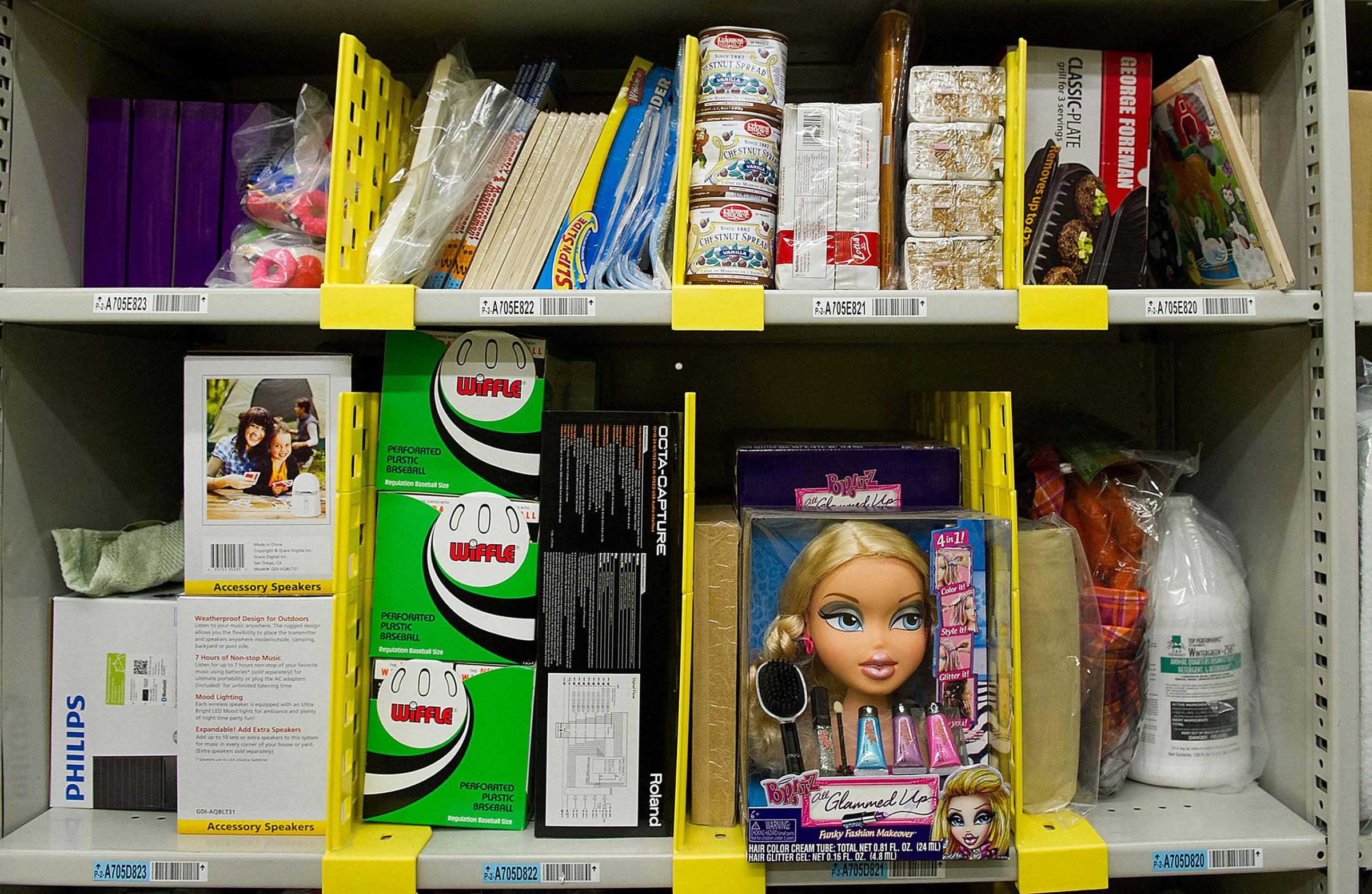 Merchandise sits on shelves before shipment at the Amazon.com Inc. distribution center in Phoenix, Arizona, Nov. 26, 2012.