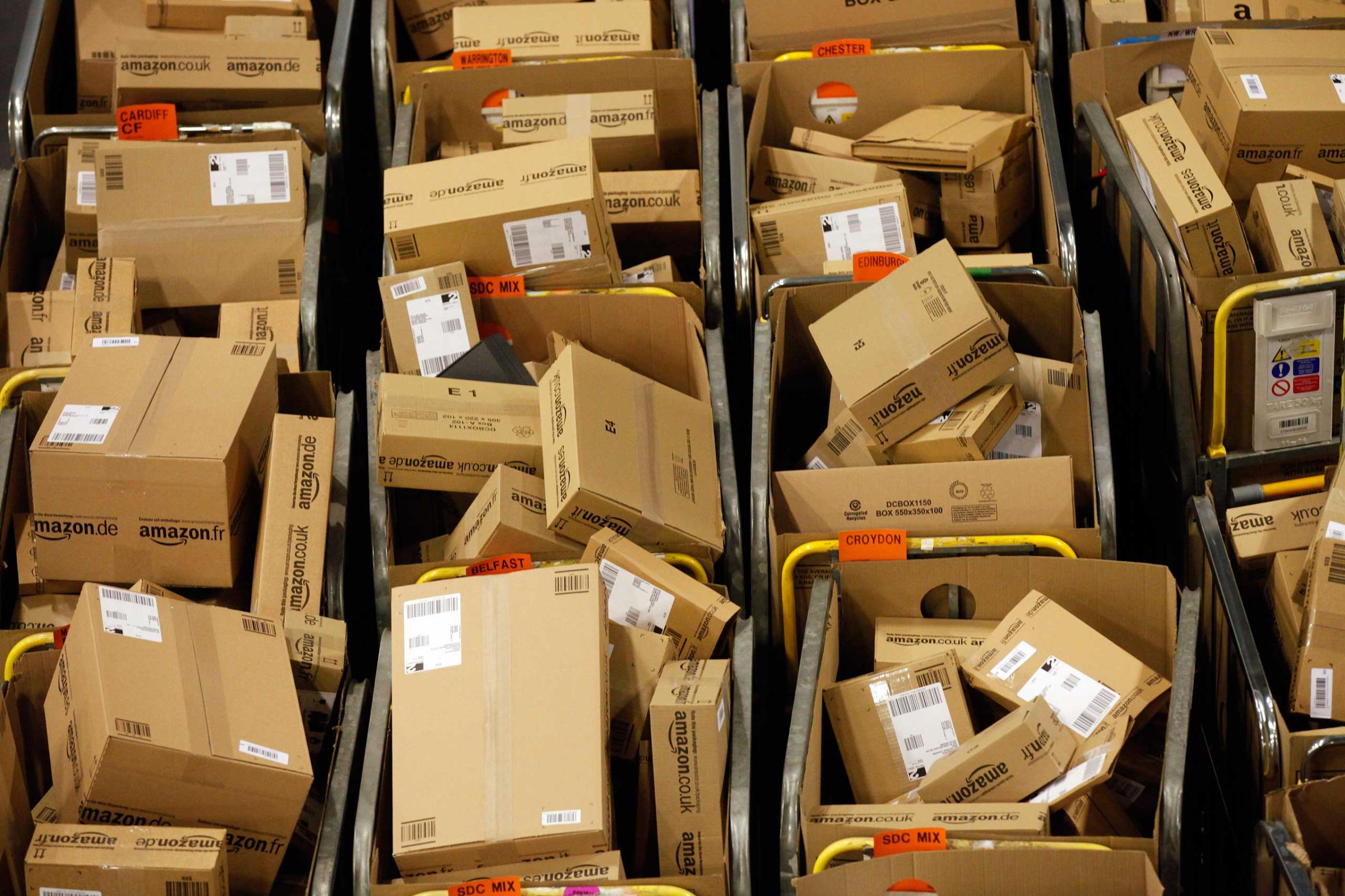 Packages sit in regional delivery dividers ahead of distribution at the Amazon.co.uk Marston Gate 'Fulfillment Center,' the U.K. site of Amazon.com Inc. in Ridgmont, United Kingdom, Dec. 3, 2012.