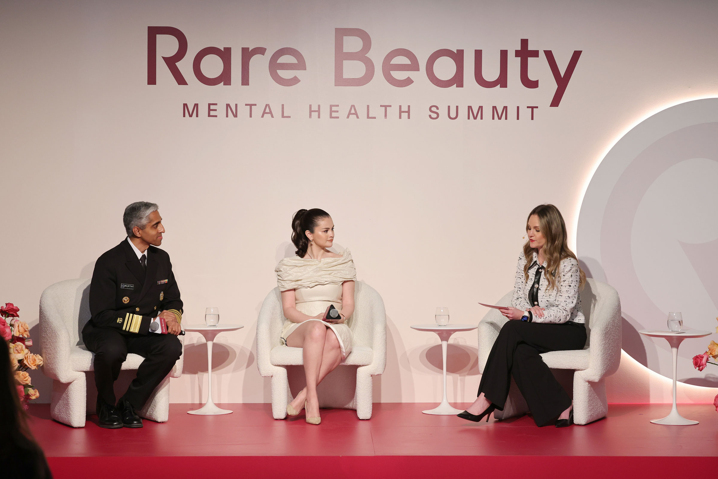 Surgeon General Vivek H. Murthy, Selena Gomez, and Elyse Cohen speak onstage during Rare Beauty’s 3rd Annual Mental Health Summit on May 1, 2024, in New York City.