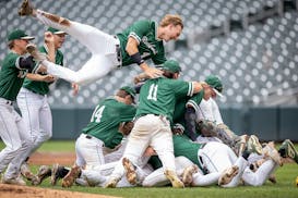 Rockford’s players celebrate a 6-0 win over Foley that made them the Class 2A champions.