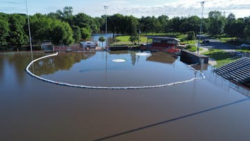 Memorial Ballpark in Dundas, Minn., on Sunday, June 23, 2024, as sandbagging around the infield could not keep the rising water from the Cannon River 